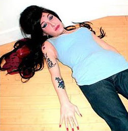Amy Winehouse, 27, found dead at her London flat after suspected 'drug overdose' 1 After the autopsy Amy Winehouse cause of death is not suspicious