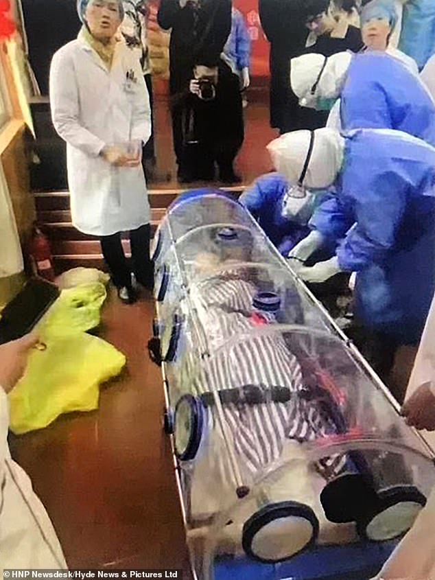 China places Wuhan City in Quarantine as Coronavirus becomes Unstoppable 4 23741668 7916223 A suspected coronavirus patient was carried out of an airport in a 23 1579733978335