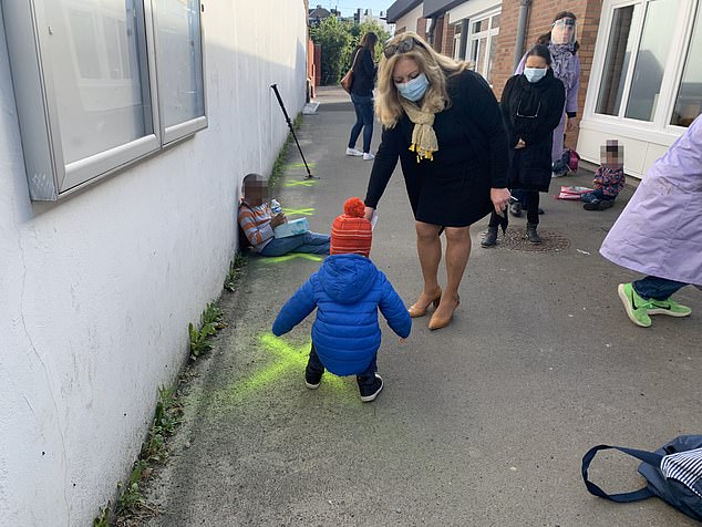 Kids in France are Forced to Play in Isolation at Schools 2 28334180 8314697 Children were also shown lining up by sitting or standing on cro a 2 1589359326192