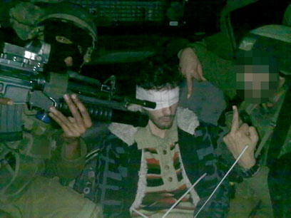 Soldiers pictured aiming rifle at Palestinian detainee 2 4 wa