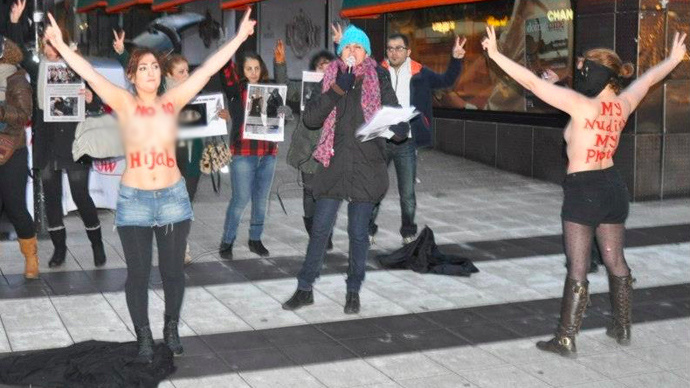 Iranian women organize topless protest against hijabs in Swedish capital 2 1