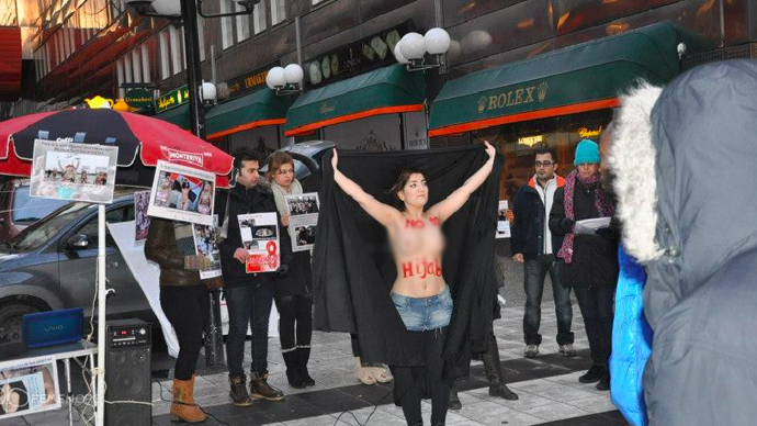 Iranian women organize topless protest against hijabs in Swedish capital 3 2