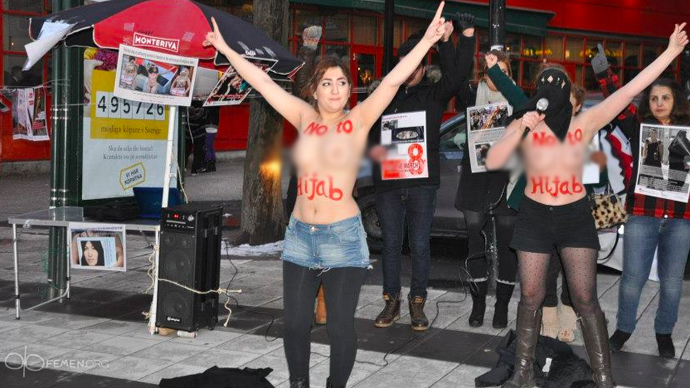 Iranian women organize topless protest against hijabs in Swedish capital 4 3