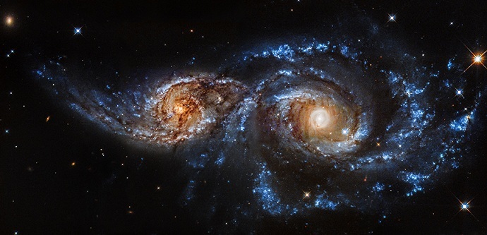 Galaxies spiral into each other, create spectacular light show 3 121814 ngc2207 optical