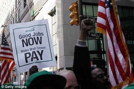 Goldman Sachs facing a U.S. criminal probe into fraud on a historic scale 7 Protestors pass by Wall Street and Broadway in lower Manhattan during the march against banking policy