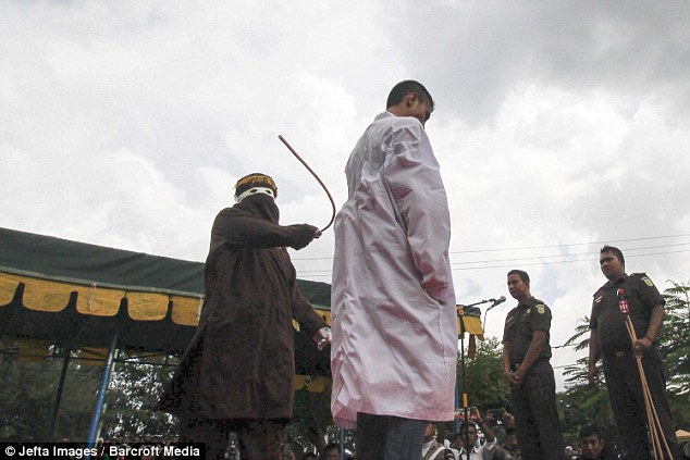 Indonesian couple lashed until collapse under Sharia for being seen together 2 2FA9334200000578 3377187 image a 20 1451384774983