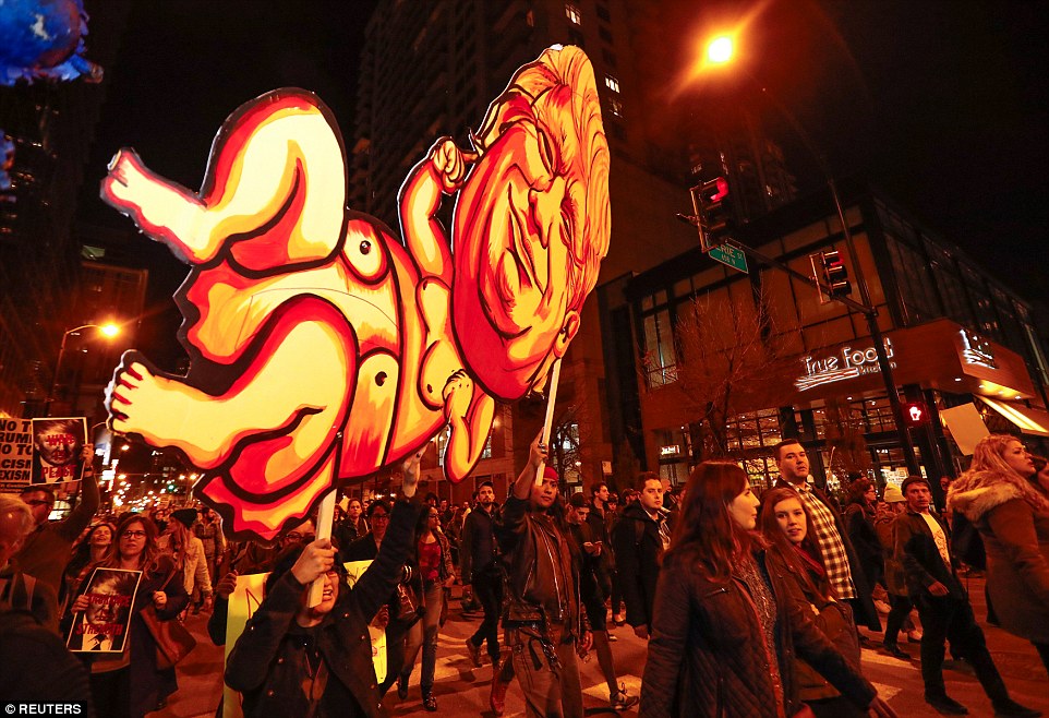 Riots Getting out of Control, They are now shouting "Kill Trump" 41 3A378AB800000578 3922098 Chicago Protesters hold aloft a giant baby Trump placard and pos a 34 1478778493562