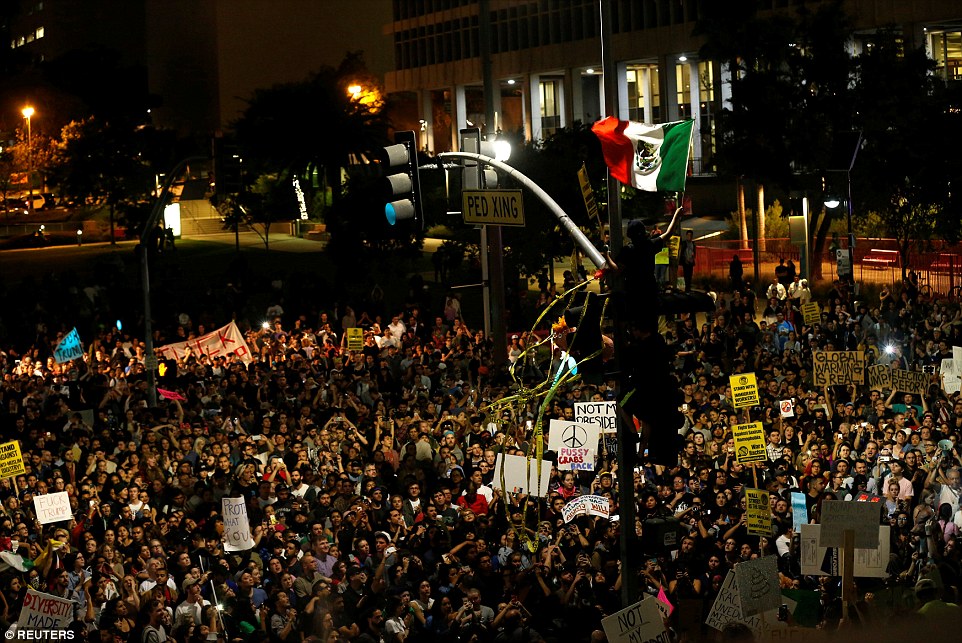 Riots Getting out of Control, They are now shouting "Kill Trump" 9 3A38BF8400000578 3922098 Los Angeles Protester waves a Mexican flag outside City Hall in a 19 1478776851431
